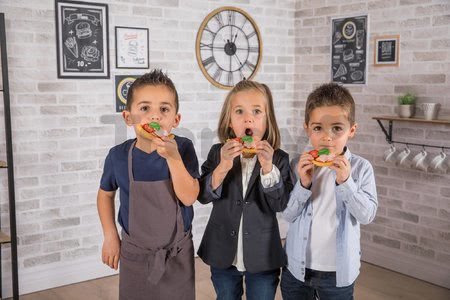 Reštaurácia s elektronickou kuchynkou Chef Corner Restaurant Smoby obojstranná s tečúcou vodou a špecialitami výškovo nastaviteľná 70 doplnkov