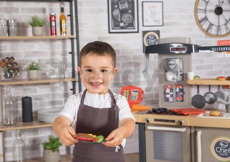 Reštaurácia s elektronickou kuchynkou Chef Corner Restaurant Smoby obojstranná s tečúcou vodou a špecialitami výškovo nastaviteľná 70 doplnkov