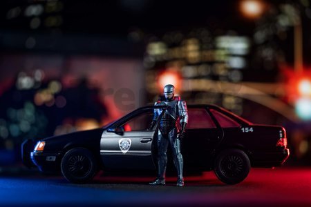 Autíčko RoboCop Ford Taurus 1986 Jada kovové s otvárateľnými časťami a figúrkou Robocop dĺžka 20 cm 1:24