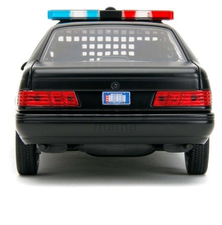 Autíčko RoboCop Ford Taurus 1986 Jada kovové s otvárateľnými časťami a figúrkou Robocop dĺžka 20 cm 1:24