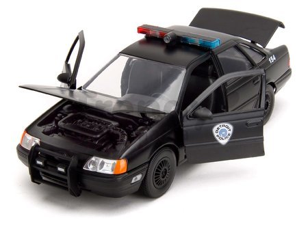 Autíčko RoboCop Ford Taurus 1986 Jada kovové s otvárateľnými časťami a figúrkou Robocop dĺžka 20 cm 1:24