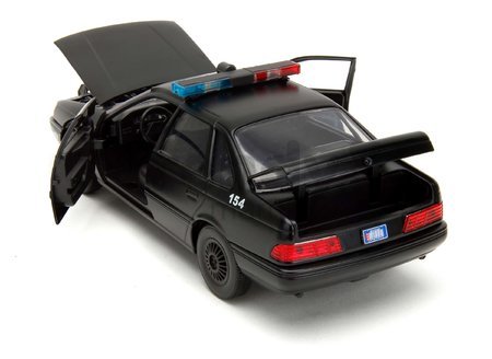 Autíčko RoboCop Ford Taurus 1986 Jada kovové s otvárateľnými časťami a figúrkou Robocop dĺžka 20 cm 1:24