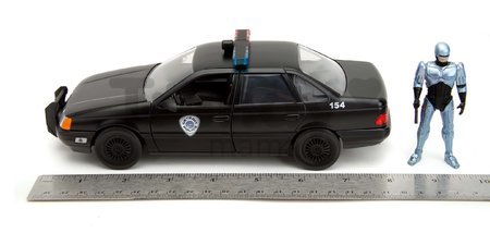 Autíčko RoboCop Ford Taurus 1986 Jada kovové s otvárateľnými časťami a figúrkou Robocop dĺžka 20 cm 1:24