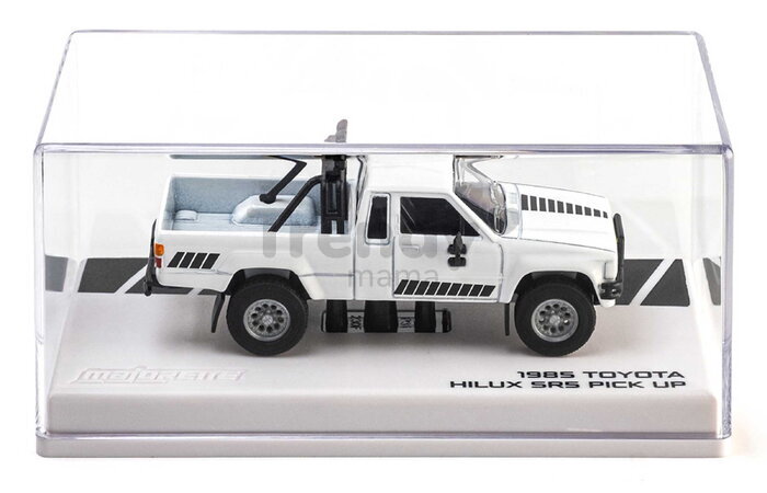 Autíčko Collection 1985 Toyota Hilux SR5 Pick Up Majorette mașinuță metalică în cutie de expunere, cu roți din cauciuc, lungime 7,5 cm, 1:64