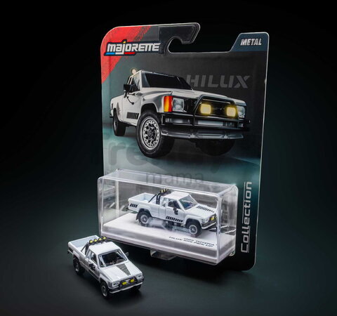 Autíčko Collection 1985 Toyota Hilux SR5 Pick Up Majorette mașinuță metalică în cutie de expunere, cu roți din cauciuc, lungime 7,5 cm, 1:64
