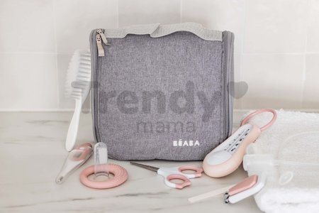 Toaletné potreby pre bábätko Hanging Toiletry Pouch Beaba v závesnej taštičke s 9 doplnkami ružová