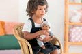 Bábika Bébé Calin Marius Corolle s čiernymi klipkajúcimi očami a fazuľkami 30 cm od 18 mes