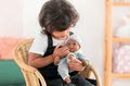 Bábika Bébé Calin Marius Corolle s čiernymi klipkajúcimi očami a fazuľkami 30 cm od 18 mes
