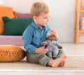 Bábika Bébé Calin Marius Corolle s čiernymi klipkajúcimi očami a fazuľkami 30 cm od 18 mes
