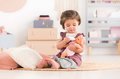 Bábika Bébé Calin Good Night Set Corolle s modrými klipkajúcimi očami a spacím vakom s fľašou a cumlíkom 30 cm od 18 mes