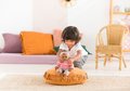 Bábika Bébé Calin Maria Corolle s hnedými klipkajúcimi očami a fazuľkami 30 cm od 18 mes