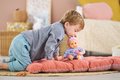 Bábika Bébé Calin Capucine Mon Premier Poupon Corolle s hnedými klipkajúcimi očami 30 cm od 18 mes