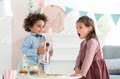 Bábika Mini Corolline Ruby Les Trendies Corolle s hnedými očami a žlté kvetinky na šatách 20 cm