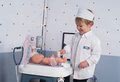 Zdravotnícky pult pre lekára Baby Care Center Smoby elektronický so zvukom a svetlom a bábika s 28 doplnkami