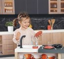 Kuchynka ostrovček s magickými cestovinami Kitchen Island 360° Smoby obojstranná s otvárateľnou rúrou a úložným priestorom 23 doplnkov