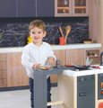 Kuchynka ostrovček s magickými cestovinami Kitchen Island 360° Smoby obojstranná s otvárateľnou rúrou a úložným priestorom 23 doplnkov