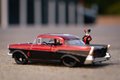 Autíčko DC Chevy Bel Air 1957 Jada kovové s otvárateľnými dverami a figúrkou Harley Quinn dĺžka 13 cm 1:32