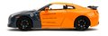 Autíčko Nissan GT-R 2009 Jada kovové s otvárateľnými časťami a figúrka Naruto dĺžka 20 cm 1:24