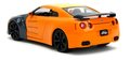 Autíčko Nissan GT-R 2009 Jada kovové s otvárateľnými časťami a figúrka Naruto dĺžka 20 cm 1:24