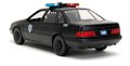 Autíčko RoboCop Ford Taurus 1986 Jada kovové s otvárateľnými časťami a figúrkou Robocop dĺžka 20 cm 1:24