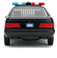 Autíčko RoboCop Ford Taurus 1986 Jada kovové s otvárateľnými časťami a figúrkou Robocop dĺžka 20 cm 1:24