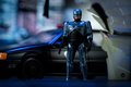 Autíčko RoboCop Ford Taurus 1986 Jada kovové s otvárateľnými časťami a figúrkou Robocop dĺžka 20 cm 1:24