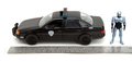 Autíčko RoboCop Ford Taurus 1986 Jada kovové s otvárateľnými časťami a figúrkou Robocop dĺžka 20 cm 1:24