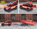 Autíčko hasičské s prívesom a loďou Land Rover Fire Rescue Majorette kovové so zvukom a svetlom dĺžka 33,5 cm