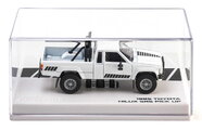 Autíčko Collection 1985 Toyota Hilux SR5 Pick Up Majorette mașinuță metalică în cutie de expunere, cu roți din cauciuc, lungime 7,5 cm, 1:64
