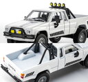 Autíčko Collection 1985 Toyota Hilux SR5 Pick Up Majorette mașinuță metalică în cutie de expunere, cu roți din cauciuc, lungime 7,5 cm, 1:64