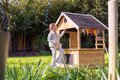 Domček cyprusový Hika Wooden Playhouse Exit Toys s tabuľou na kreslenie kriedou a koleso s 8 aktivitami od 24 mes