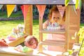Domček cyprusový Hika Wooden Playhouse Exit Toys s tabuľou na kreslenie kriedou a koleso s 8 aktivitami od 24 mes