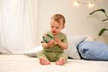 Drevená hrkálka Baby HiPP Sound Rattle Eichhorn s držadlom a valcom s guličkami od 3 mes