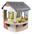 Domček s pracovným pultom pre záhradníka so 16 doplnkami Mud Cooking House Life Smoby rozšíriteľný s 2 dverami a funkčnou nádržou na vodu s UV filtrom