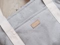 Prebaľovacia taška ku kočíku Changing Bag Paris Beaba Pearl Grey s doplnkami sivá