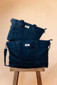 Prebaľovacia taška ku kočíku Madrid Bag XXl Denim Beaba s prebaľovacou podložkou a popruhmi ku kočíku extra veľká modrá