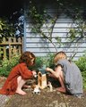 Drevený veterný mlyn Penny Windmill Tender Leaf Toys s pecou na pečenie chleba a 3 figúrky myšiek